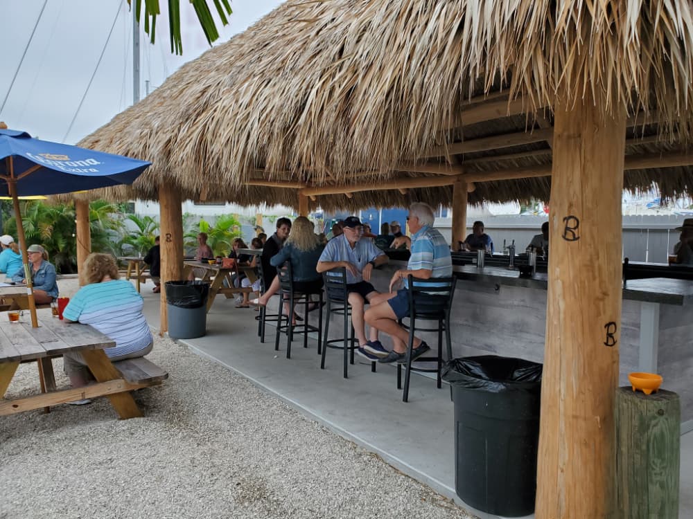 Riviera Bar and Grill. Indoor dining just steps from your boat. Outdoor dining under grass tiki hut.